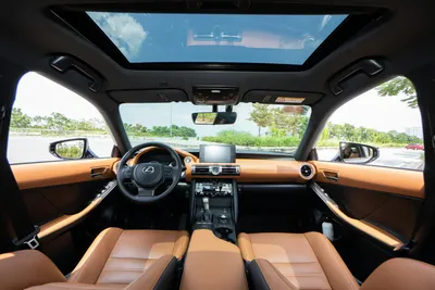 A view of the steering wheel and dashboard inside a car